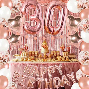 Rose gold birthday decoration set with 'Happy Birthday' banner, 30 foil balloons, and confetti balloons, creating a festive party atmosphere.