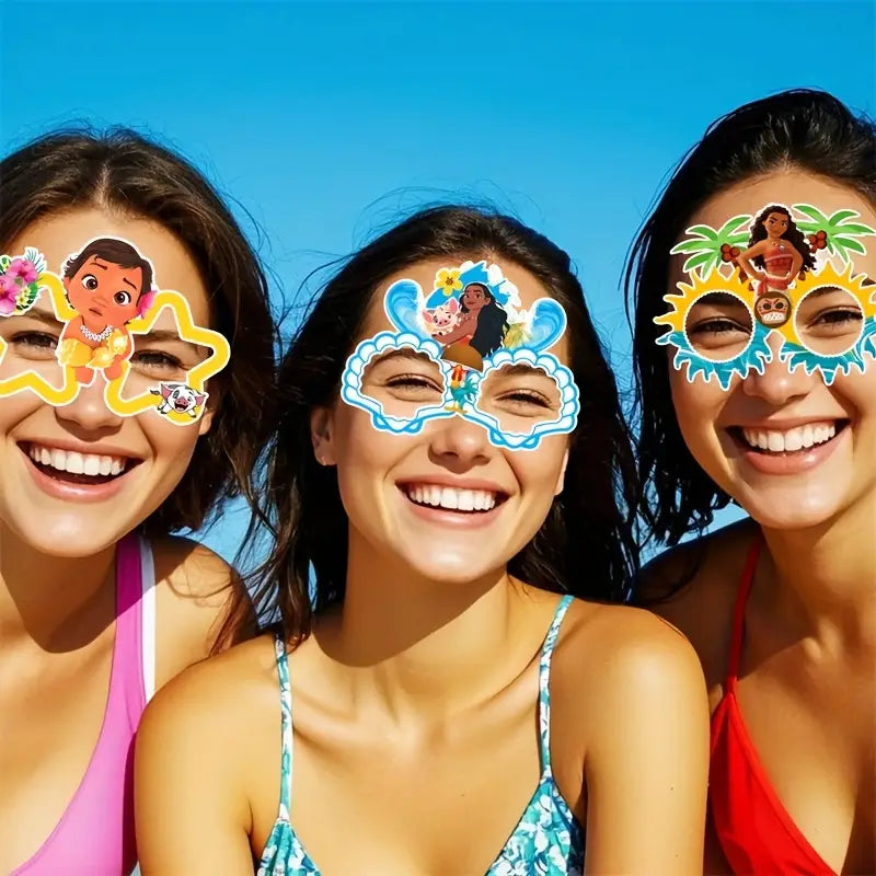 People smiling while wearing Moana-themed glasses at a beach party, showing different character designs.