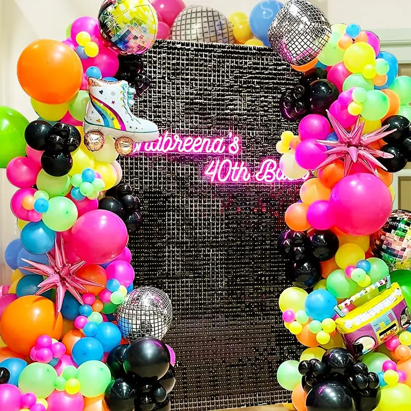 roller disco balloon arch with neon party backdrop for 40th birthday celebration