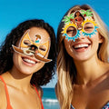 Group of friends enjoying a beach party, each wearing Moana-themed party glasses.
