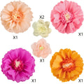 artificial flowers used as party wall backdrop for cake table setup.