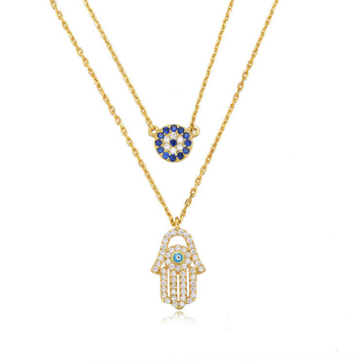 A meaningful layered necklace combining the power of the Hamsa Hand and the Evil Eye S925– believed to protect against negativity and bring blessings.