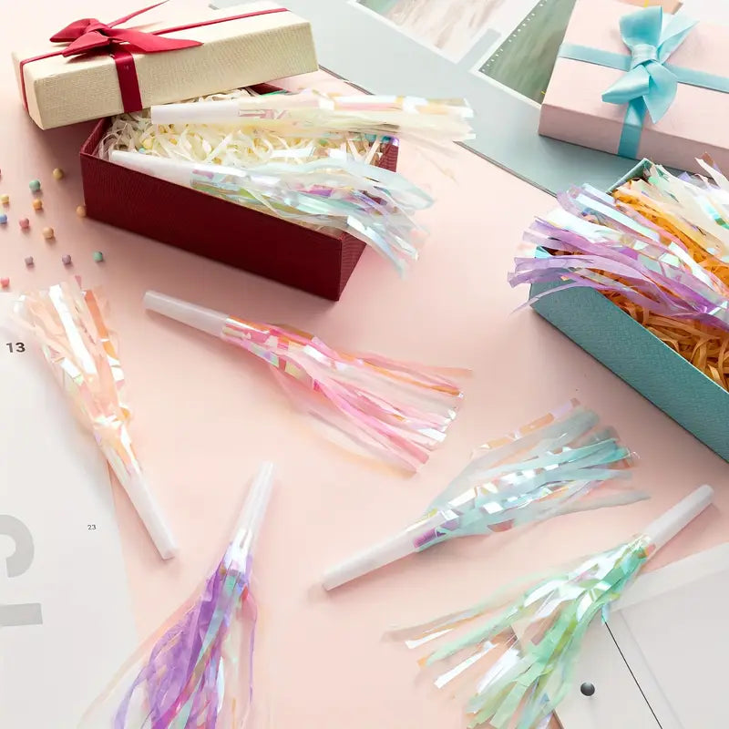 Party blowouts displayed in gift boxes for celebrations